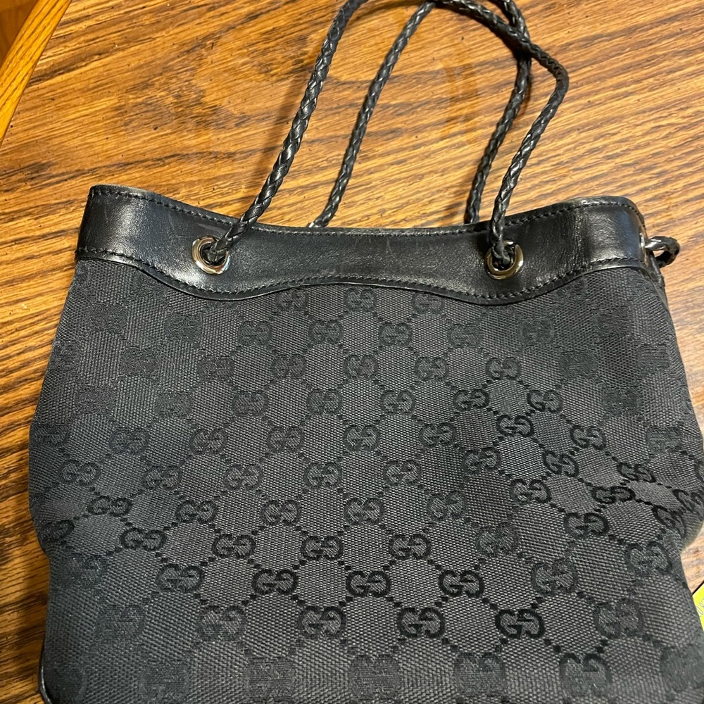 Authentic monogram Gucci bag with braided handle